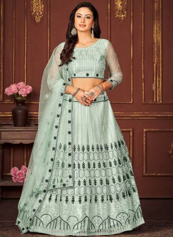 Garb These Partywear Lehenga Choli in Fine Colored.These Lehenga Are Net Choli Are Net And Dupatta Are Fabricated On Net Pair.Its Beautified With Designer Embroidery Work.