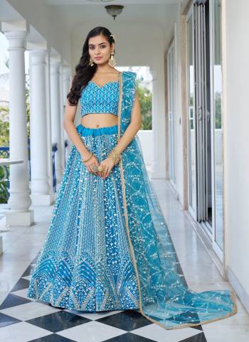 For A Different Look,Grab These Party Wear Designer Lehenga in All Over Pretty Colored Pair With Blouse And Dupatta.These Lehenga Choli And Dupatta is All Over Butterfly Net Base Fabric With Designer Cotton Thread,Sequance Embroidery Work.