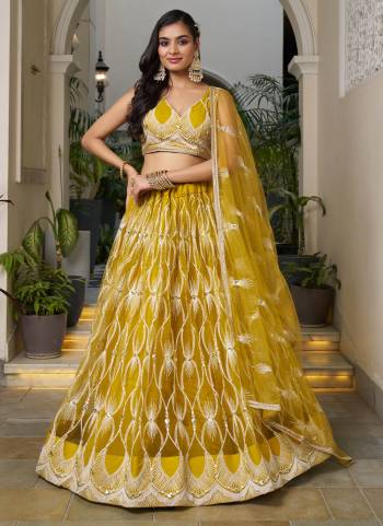 For A Different Look,Grab These Party Wear Designer Lehenga in All Over Pretty Colored Pair With Blouse And Dupatta.These Lehenga Choli And Dupatta is All Over Butterfly Net Base Fabric With Designer Cotton Thread,Sequance Embroidery Work.