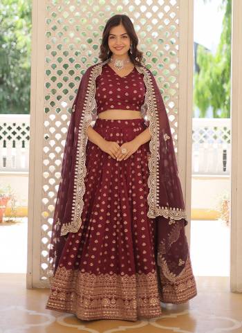 For A Designer Look,Grab These Lehenga Choli in Fine Colored.These Lehenga And Blouse Are Fabricated On Viscose Jacquard Pair With Faux Tabby Dupatta.Its Beautified With Wevon Jacquard Designer With Embroidery Work.