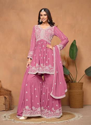 Garb These Party Wear Sharara Suit in Fine Colored Pair With Bottom And Dupatta.These Top And Dupatta Are Fabricated On Faux Georgette Pair With Faux Georgette Bottom.Its Beautified With Santoon Inner.Its Beautified With Designer Heavy Embroidery Work.