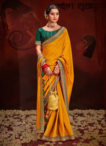 Garb These Party Wear Saree in Fine Colored.These Saree Are Vichitra Silk And Blouse is Fabricated On Raw Silk.Its Beautified With Designer Embroidery Work Blouse And Lace Border With Swarovski Work.