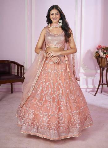 For A Designer Look,Grab These Lehenga Choli in Fine Colored.These Lehenga And Choli Are Fabricated On Soft Net Pair With Soft Net Dupatta.Its Beautified With Designer Sequance,Jari,Thread,Badla Embroidery Work.