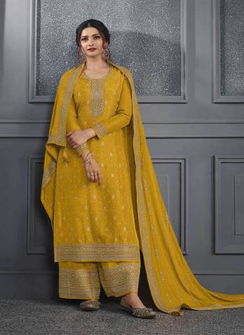 Yellow colored Salwar suit is prettified with Embroidery work , Sequence Work and Diamond Work as shown which makes it appear classy. This top is made of Dola Silk fabric which is accompanied with Santoon bottom and Georgette dupatta. Women can buy this suit to wear for their parties and functions.