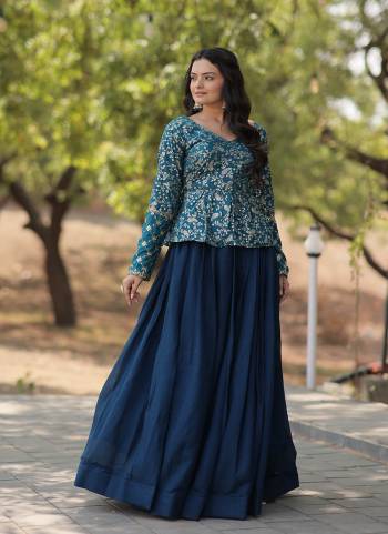 Explore This Trending Fashionable Crop Top with Pure Viscose Dayble Flower Design & Sequins Embroidered work Blouse and Plain Lehenga Which looks Amazing for Any Functions.