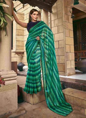 Beautifully Crafted Smart Hand with Stone work & Print Saree For The Real Fashion Seekers. This Saree Is Fabricated On Satin Silk Fabric With Festive Green Color For Glamorous Looks.