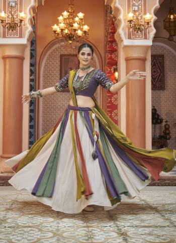 Attrective These Navratri Special Lehenga Choli in Fine Colored.These Lehenga Are Viscose Rayon And Blouse Are Viscose Rayon And Dupatta Are Fabricated On Viscose Rayon.Its Beautified With Designer Mirror,Thread Embroidery Work.