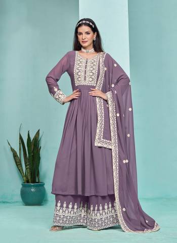 Garb These Party Wear Plazzo Suit in Fine Colored Pair With Bottom And Dupatta.These Top And Bottom Are Fabricated On Faux Georgette Pair With Faux Georgette Dupatta.Its Beautified With Santoon Inner.Its Beautified With Designer Heavy Embroidery Work.