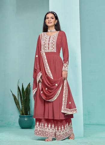 Garb These Party Wear Plazzo Suit in Fine Colored Pair With Bottom And Dupatta.These Top And Bottom Are Fabricated On Faux Georgette Pair With Faux Georgette Dupatta.Its Beautified With Santoon Inner.Its Beautified With Designer Heavy Embroidery Work.