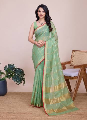 Garb This Partywear Saree Paired With Blouse.This Saree And Blouse Are Kota Doriya Based Fabric With Weaving Jari Designer. Buy This Pretty Saree Now.