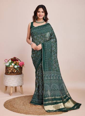 Attrective This Partywear Saree Paired With Blouse.This Saree And Blouse Are Cotton Silk Based Fabric With Weaving Jari Pallu With Bandhani Printed Designer. Buy This Pretty Saree Now.