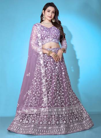 Grab These Beautiful Colored Lehenga Choli.These Lehenga and Dupatta Are Fabricated On Net Pair With Net Blouse.Its Beautified With Heavy Thread Embroidery Work.