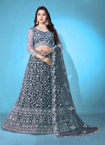 Grab These Beautiful Colored Lehenga Choli.These Lehenga and Dupatta Are Fabricated On Net Pair With Net Blouse.Its Beautified With Heavy Thread Embroidery Work.