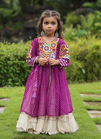 Grab These Navratri special Adult And Kids Lehenga Kurti in Fine Colored. These Lehenga Are Kora Cotton And Kurti Are Fabricated On Georgette Fabric. It is Beautified With Designer Printed With Traditional (Gamthi) Thread Work. Grace This Garba Season With This Beautiful Gamthi Work Attire.