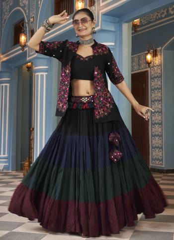 Attrective These Navratri Special Lehenga Choli in Fine Colored.These Lehenga Are Viscose Rayon And Blouse Are Viscose Rayon And Dupatta Are Fabricated On Viscose Rayon.Its Beautified With Designer Mirror,Thread Embroidery Work.