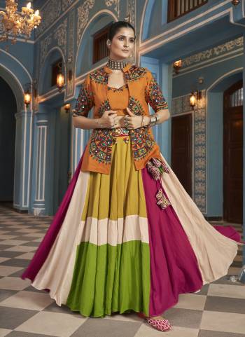 Attrective These Navratri Special Lehenga Choli in Fine Colored.These Lehenga Are Viscose Rayon And Blouse Are Viscose Rayon And Dupatta Are Fabricated On Viscose Rayon.Its Beautified With Designer Mirror,Thread Embroidery Work.