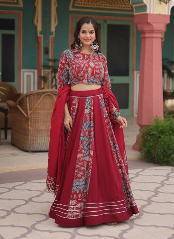 For A Designer Look,Grab These Lehenga Choli in Fine Colored.These Lehenga And Blouse Are Fabricated On Rayon Pair With Rayon Dupatta.Its Beautified With Designer Printed With Gota Pati Lace Work.