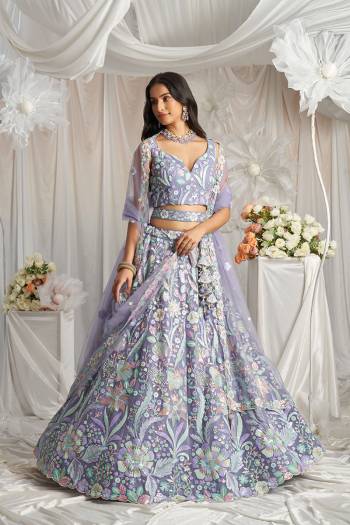 Attrective Looking This Partywear Fine Color Fancy Heavy Designer Choli And Lahenga Fabriced On Net And Dupatta Net In Fabricated Beautified With Attrective Designer Heavy Embroidery Work. Buy Now.