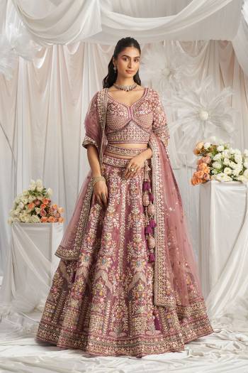 Attrective Looking This Partywear Fine Color Fancy Heavy Designer Choli And Lahenga Fabriced On Tissue And Dupatta Net In Fabricated Beautified With Attrective Designer Heavy Embroidery Work. Buy Now.