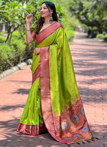 Looking These Party Wear Saree in Fine Colored.These Saree And Blouse is Fabricated On Paithani Silk.Its Beautified With Weaving Meenakari Designer.