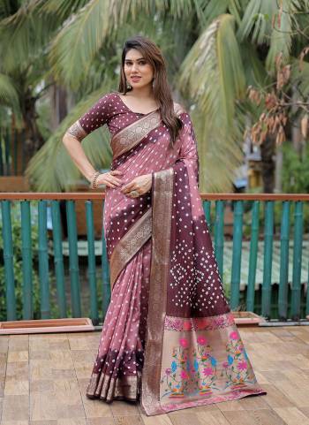 Garb These Party Wear Saree in Fine Colored.These Saree And Blouse is Fabricated On Dola Silk.Its Beautified With Wevon Paithani Pallu Border Designer With Handmade Bandhej Printed.