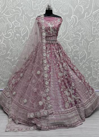 For A Fancy Designer Look,Grab These Lehenga Choli With Dupatta in Fine Colored.These Lehenga And Choli Are Gadhwal Silk And Dupatta Are Fabricated On Soft Net Pair.Its Beautified With Designer Sequance,Dori,Multy Thread Embroidery With Zircon Diamond Work.