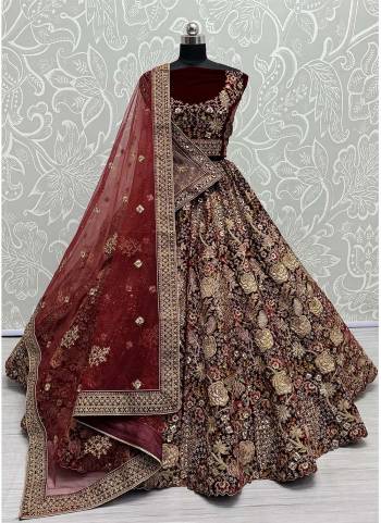 For A Fancy Designer Look,Grab These Lehenga Choli With 2 Dupatta in Fine Colored.These Lehenga And Choli Are Velvet And Dupatta Are Fabricated On Soft Net & Net Pair.Its Beautified With Designer Double Sequance,Thread,Dori,Jari Embroidery With Diamond Work.