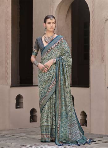 Garb These Fastival Wear Saree in Fine Colored.These Saree And Blouse is Fabricated On Sigma Silk.Its Beautified With Designer Ajrakh Printed With Aqua Finished.