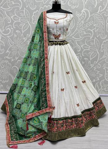 For A Fancy Designer Look,Grab These Lehenga Choli With Dupatta in Fine Colored.These Lehenga And Choli Are Silk And Dupatta Are Fabricated On Georgette Pair.Its Beautified With Designer Double Sequance,Thread Embroidery Work With Printed Dupatta.