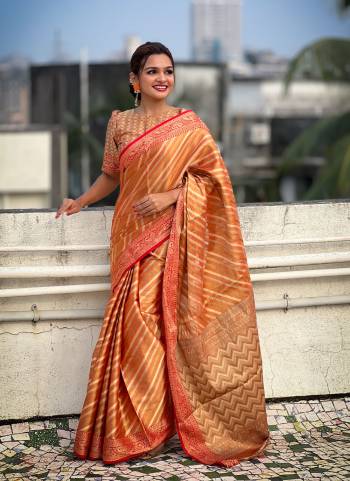 Attrective These Party Wear Saree in Fine Colored.These Saree And Blouse is Fabricated On Jari Tissue.Its Beautified With Weaving Jacquard Laheriya Designer.