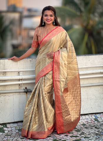 Attrective These Party Wear Saree in Fine Colored.These Saree And Blouse is Fabricated On Jari Tissue.Its Beautified With Weaving Jacquard Laheriya Designer.