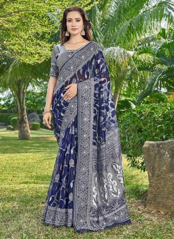 Garb These Party Wear Saree in Fine Colored.These Saree And Blouse Is Silk Cotton Fabricated.Its Beautified With Wevon Designer.