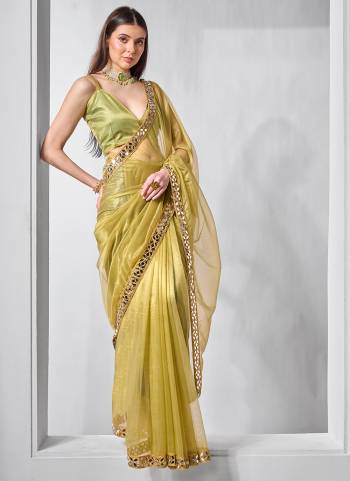 Garb These Fancy Saree in Fine Colored.These Saree Are Gold Tissue Net And Blouse is Fabricated On Art Silk Pair.Its Beautified With Solid,Gold Cotted Work.