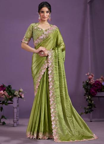 Look Attrective These Designer Party Wear Saree in Fine Colored.These Saree Are Two Tone Satin Silk And Blouse Satin Silk is Fabricated.Its Beautified Heavy Desiger Embroidery Moti Work.