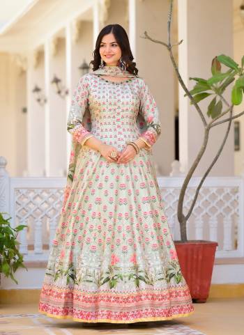 Garb These Designer Gown in Fine Colored Pair With Dupatta.These Gown Are Fabricated On Dola Silk Pair With Chinon Dupatta.Its Beautified With Designer Digital Printed With Hand Work.