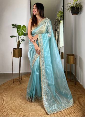 Garb These Party Wear Saree in Fine Colored.These Saree Are Silver Tissue Silk And Blouse is Silver Tissue Silk Fabricated.Its Beautified With Designer Sequance,Jari,Real Mirror Embroidery Work.