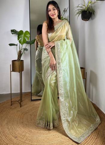 Garb These Party Wear Saree in Fine Colored.These Saree Are Silver Tissue Silk And Blouse is Silver Tissue Silk Fabricated.Its Beautified With Designer Sequance,Jari,Real Mirror Embroidery Work.