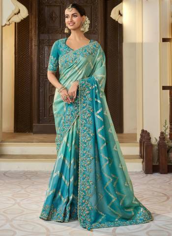 Attrective This Partywear Saree Paired With Blouse.This Saree Are Viscose Tissue And Blouse Are Viscose Tissue Based Fabric With Weaving Jari Designer With Embroidery Work. Buy This Pretty Saree Now.