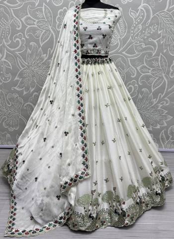 For A Fancy Designer Look,Grab These Lehenga Choli With Dupatta in Fine Colored.These Lehenga And Choli Are Silk And Dupatta Are Fabricated On Chinon Pair.Its Beautified With Designer Double Sequance,Thread Embroidery Work.