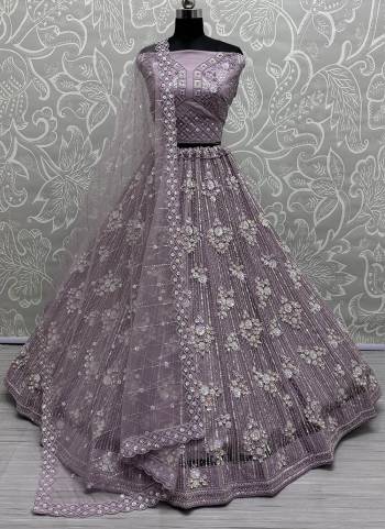 For A Fancy Designer Look,Grab These Lehenga Choli With Dupatta in Fine Colored.These Lehenga And Choli Are Net And Dupatta Are Fabricated On Net Pair.Its Beautified With Designer Sequance,Dori Embroidery,Zarkan Work.