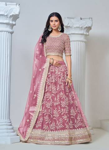 For A Designer Look,Grab These Lehenga Choli in Fine Colored.These Lehenga And Blouse Are Fabricated On Net Pair With Net Dupatta.Its Beautified With Designer Thread,Sequance Embroidery Work.