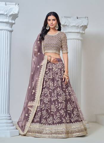 For A Designer Look,Grab These Lehenga Choli in Fine Colored.These Lehenga And Blouse Are Fabricated On Net Pair With Net Dupatta.Its Beautified With Designer Thread,Sequance Embroidery Work.