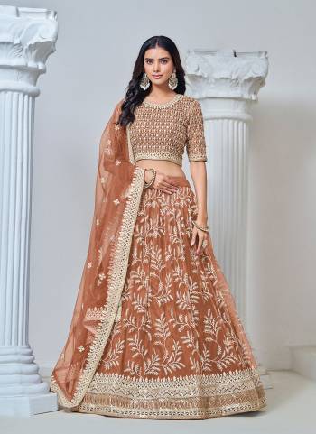 For A Designer Look,Grab These Lehenga Choli in Fine Colored.These Lehenga And Blouse Are Fabricated On Net Pair With Net Dupatta.Its Beautified With Designer Thread,Sequance Embroidery Work.