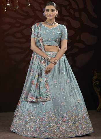 For A Fancy Designer Look,Grab These Lehenga Choli With Dupatta in Fine Colored.These Lehenga And Choli Are Chinon And Dupatta Are Fabricated On Georgette Pair.Its Beautified With Designer Sequance,Thread Embroidery Work With Flower Printed Dupatta.