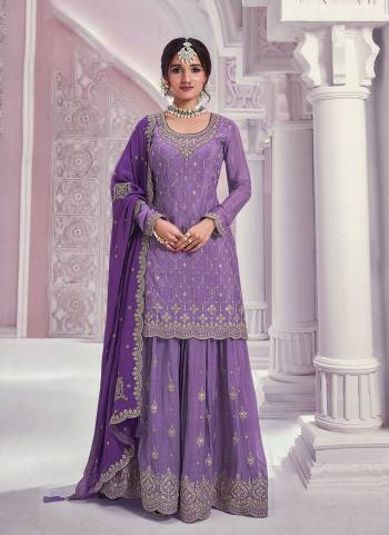 Garb These Party Wear Designer Sharara Suits in Fine Colored Pair With Dupatta.These Top Are Chinon And Dupatta Are Fabricated On Chinon Pair With Chinon Bottom.Its Beautified With Heavy Designer Embroidery Work