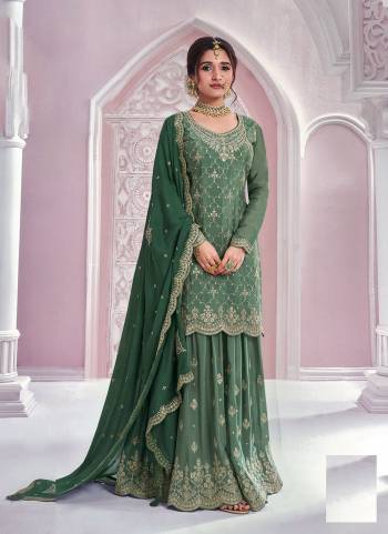 Garb These Party Wear Designer Sharara Suits in Fine Colored Pair With Dupatta.These Top Are Chinon And Dupatta Are Fabricated On Chinon Pair With Chinon Bottom.Its Beautified With Heavy Designer Embroidery Work