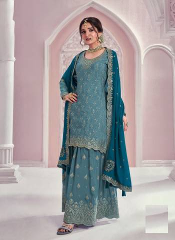 Garb These Party Wear Designer Sharara Suits in Fine Colored Pair With Dupatta.These Top Are Chinon And Dupatta Are Fabricated On Chinon Pair With Chinon Bottom.Its Beautified With Heavy Designer Embroidery Work