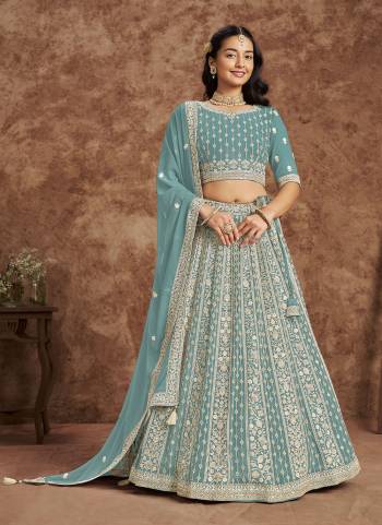 For A Designer Look,Grab These Lehenga Choli in Fine Colored.These Lehenga And Blouse Are Fabricated On Faux Georgette Pair With Faux Georgette Dupatta.Its Beautified With Designer Embroidery Work.