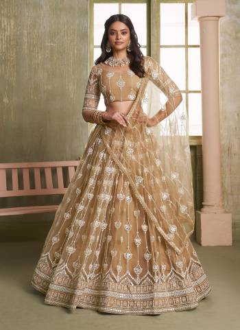 For A Different Look,Grab These Party Wear Designer Lehenga in All Over Pretty Colored Pair With Blouse And Dupatta.These Lehenga Choli And Dupatta is All Over Butterfly Net Base Fabric With Designer Thread,Sequance,Mirror Embroidery Work.