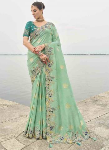 Attrective These Party Wear Saree in Fine Colored.These Saree Are Viscose Tissue Silk And Blouse is Fabricated On Raw Silk.Its Beautified With Wevon Butti Designer With Sequance Embroidery,Stone,Cut Work .